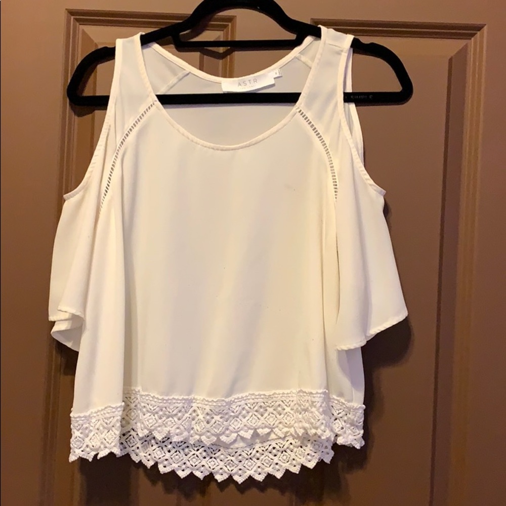 Flowy shirt with cut outs around shoulders.